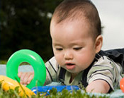Baby playing with plastic bag