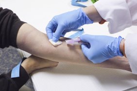 Doctor swabbing an arm